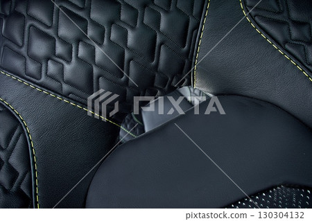 Cutting and preparing black leather or synthetic material for custom car interior 130304132