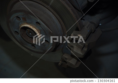 Cutting and preparing black leather or synthetic material for custom car interior 130304161
