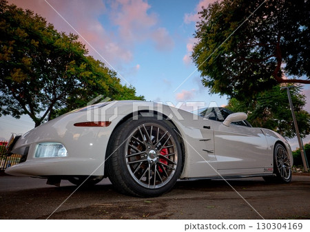 Low-angle view of a white Chevrolet Corvette Z06 sports car parked  130304169