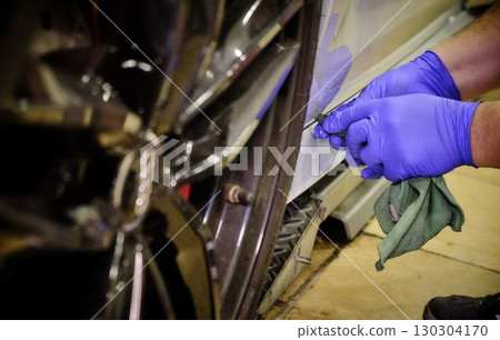 Car Repair Workshop Mechanics Working with Parts 130304170