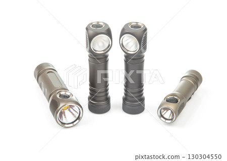Quality flashlights arranged on a white background showcasing their design and features Quality flashlights arranged on a white background showcasing their design and features 130304550