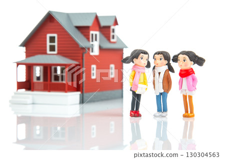 Miniature people chatting near a detailed model house on a reflective surface Miniature people chatting near a detailed model house on a reflective surface 130304563