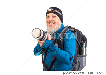 Photographer ready for adventure with camera gear and backpack in indoor setting 130304728