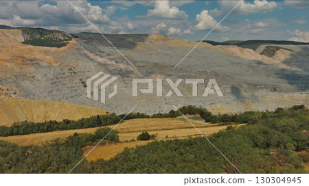 Aerial of open mine and heavy mining equipment Aerial of open mine and heavy mining equipment 130304945