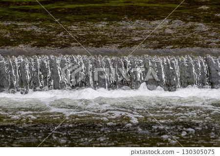 the water cascading down the river 130305075