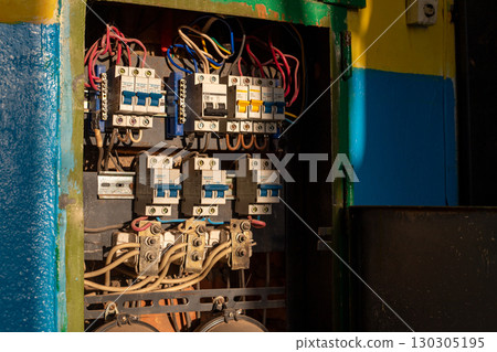 Electric distribution board consumer unit with fuse box or circuit breaker in an old industrial building Electric distribution board consumer unit with fuse box or circuit breaker in an old industrial building 130305195