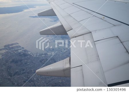 Flying airplane wing landscape 130305496