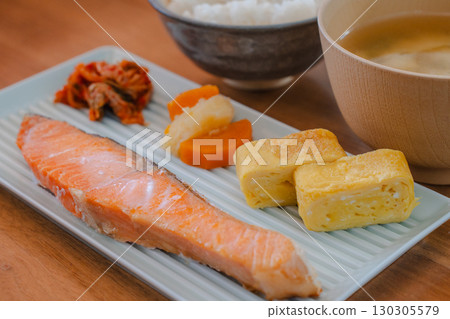 Japanese breakfast of grilled salmon and omelet served with miso soup and rice Japanese breakfast of grilled salmon and omelet served with miso soup and rice 130305579