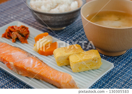 Japanese breakfast of grilled salmon and omelet served with miso soup and rice Japanese breakfast of grilled salmon and omelet served with miso soup and rice 130305583