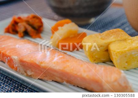 Japanese breakfast of grilled salmon and omelet served with miso soup and rice 130305588