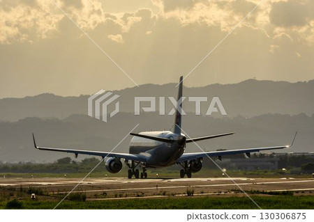 Sendai Airport at dusk, airplane taking off, Natori City, Miyagi Prefecture 130306875