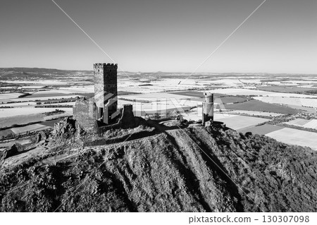Perched atop a hill in the Central Bohemian Uplands, Hazmburk castle ruins stand as a testament to medieval architecture. Perched atop a hill in the Central Bohemian Uplands, Hazmburk castle ruins stand as a testament to medieval architecture. 130307098