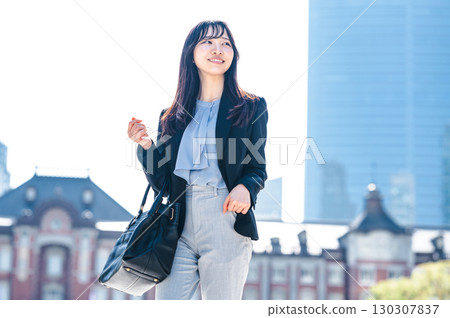 Portrait of a young career woman commuting to work Portrait of a young career woman commuting to work 130307837