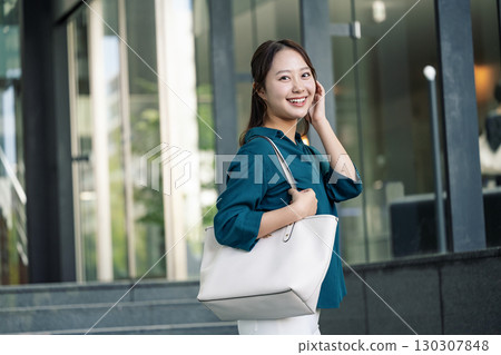 Portrait of a career woman going to work Portrait of a career woman going to work 130307848