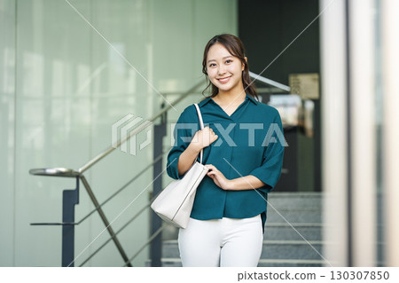 Portrait of a career woman going to work Portrait of a career woman going to work 130307850
