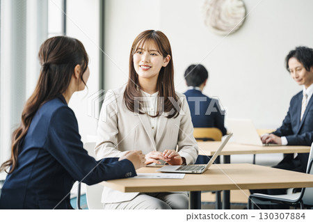 A career woman negotiating a business meeting at a table in a free space 130307884