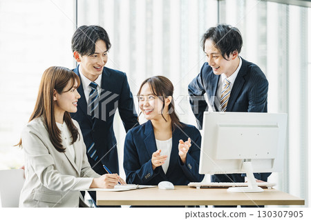 Young business people discussing in a team 130307905