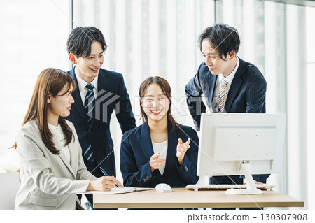 Young business people discussing in a team 130307908