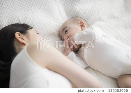 Young mother taking care of her baby Young mother taking care of her baby 130308056