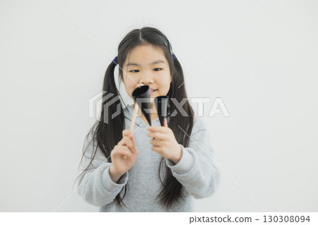 Child practicing agogobel Child practicing agogobel 130308094