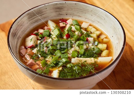 Delicious and Nourishing Fresh Vegetable Soup Enriched with Herbs and Diced Ingredients 130308210