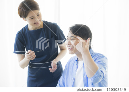 A man getting his eyebrows made 130308849