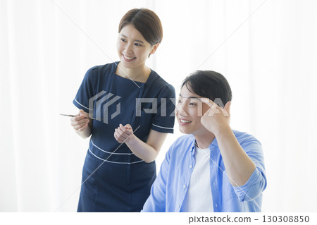 A man getting his eyebrows made 130308850