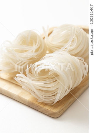 Rice noodles on white background Rice noodles on white background 130311467