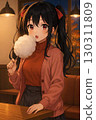 Girl eating cotton candy at a cafe 130311809