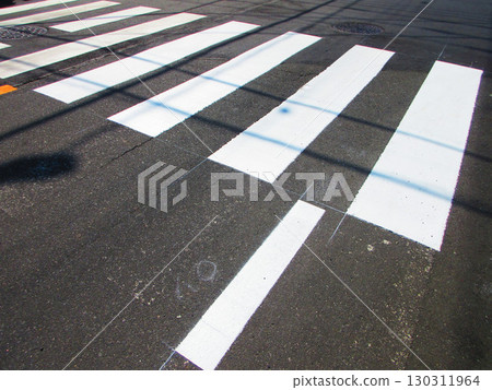 A crosswalk with no pedestrians walking 130311964
