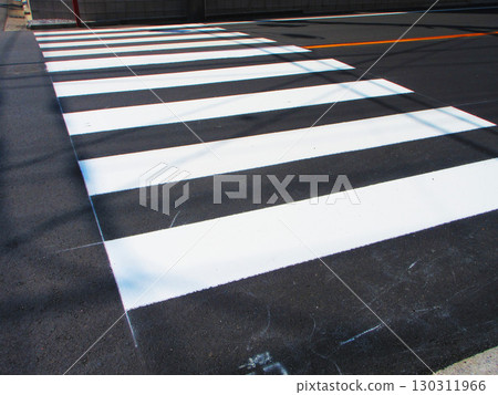 A crosswalk with no pedestrians walking 130311966