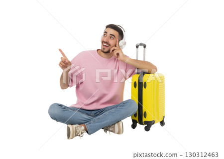 Happy young man with headphones by a suitcase, isolated, PNG Happy young man with headphones by a suitcase, isolated, PNG 130312463