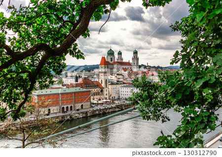 Panoramic view of Passau. View through tree branches. Aerial skyline of old town with beautiful reflection in Danube river, Bavaria, Germany. High quality photo Panoramic view of Passau. View through tree branches. Aerial skyline of old town with beautiful reflection in Danube river, Bavaria, Germany. High quality photo 130312790