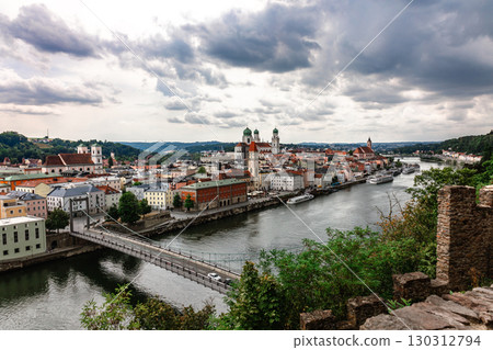 Panoramic view of Passau. Top view of suspension bridge. Aerial skyline of old town with beautiful reflection in Danube river, Bavaria, Germany. High quality photo 130312794