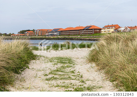 Natural beach with sand and grass in the town of Ronne on the Bornholm Island, Denmark 130312843