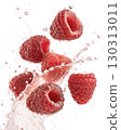 Fresh raspberries splashing in water, isolated on white background 130313011