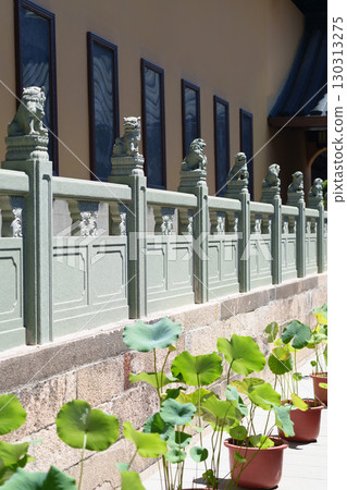 Stone lion guardrail in Chinese courtyard 130313275