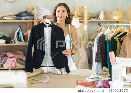 dressmaker presents a black jacket 130313575