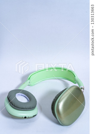 Modern wireless headphones lying on white background 130313663