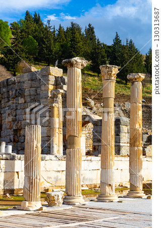 Ruins of the Upper Agora at Ephesus ancient site in Turkey. View of fragments of columns; with Sacred Street and Odeon Ruins of the Upper Agora at Ephesus ancient site in Turkey. View of fragments of columns; with Sacred Street and Odeon 130313687