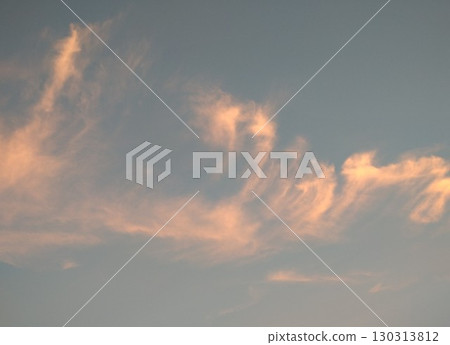Crimson clouds flowing in the evening sky 130313812