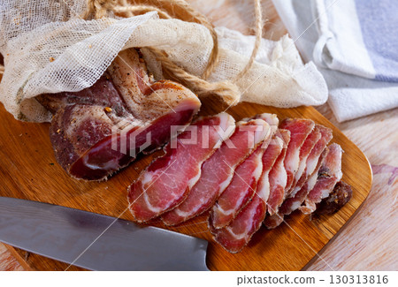 Cured pork meat sliced on wooden board Cured pork meat sliced on wooden board 130313816