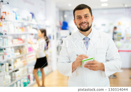 Portrait of male pharmacist working in drugstore Portrait of male pharmacist working in drugstore 130314044
