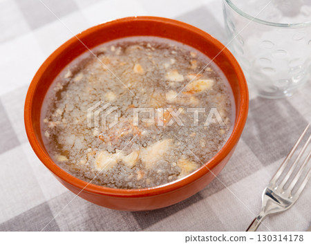 Kholodets served on dinning table 130314178