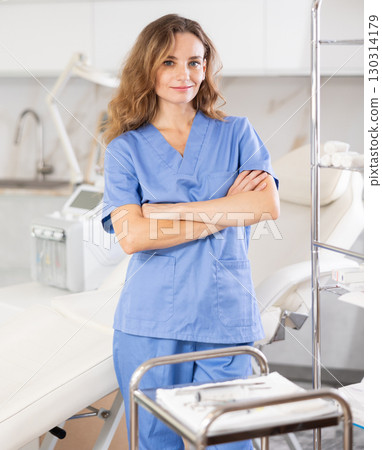 Skilled cosmetic doctor confidently stands 130314179