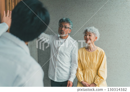 Elderly people looking at a model home Elderly people looking at a model home 130314382