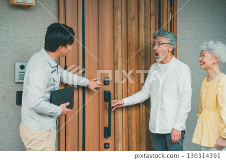 Elderly people looking at a model home Elderly people looking at a model home 130314391