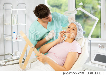 doctor calmly presents procedure's results doctor calmly presents procedure's results 130314419