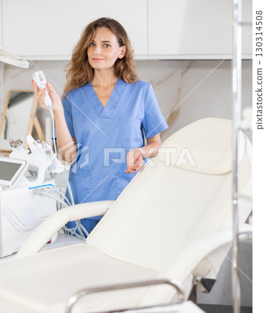 Skilled cosmetic doctor confidently stands 130314508