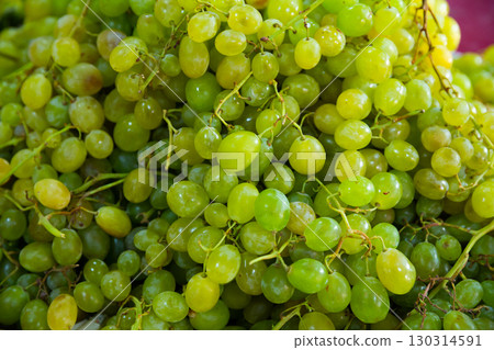 Fresh white grapes in tassels background Fresh white grapes in tassels background 130314591